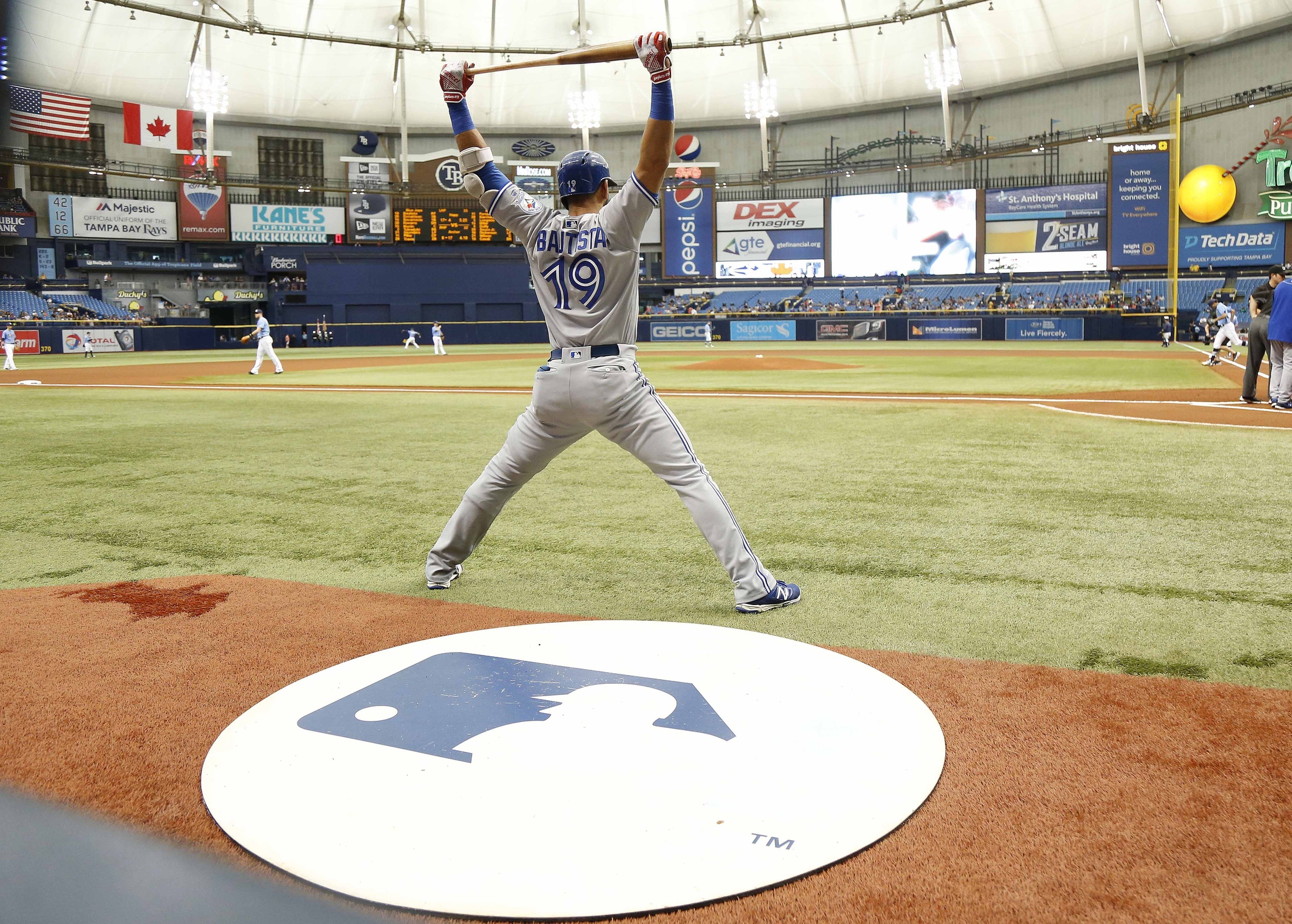 Sep 4, 2016; St. Petersburg, FL, USA; Toronto Blue Jays right fielder Jose Bautista (19) stretches while on deck to bat prior to the game against the Tampa Bay Rays at Tropicana Field. Mandatory Credit: Kim Klement-USA TODAY Sports