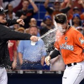 Apr 16, 2017; Miami, FL, USA; Miami Marlins Miami Marlins pinch hitter JT Riddle (R) is splashed with water by Marlins starting pitcher Tom Koehler (L) after hitting the game winning two run homer during the ninth inning against the New York Mets at Marlins Park. Mandatory Credit: Steve Mitchell-USA TODAY Sports