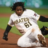May 6, 2017; Pittsburgh, PA, USA; Pittsburgh Pirates second baseman Gift Ngoepe (61) advances to third base against the Milwaukee Brewers during the tenth inning at PNC Park. Mandatory Credit: Charles LeClaire-USA TODAY Sports